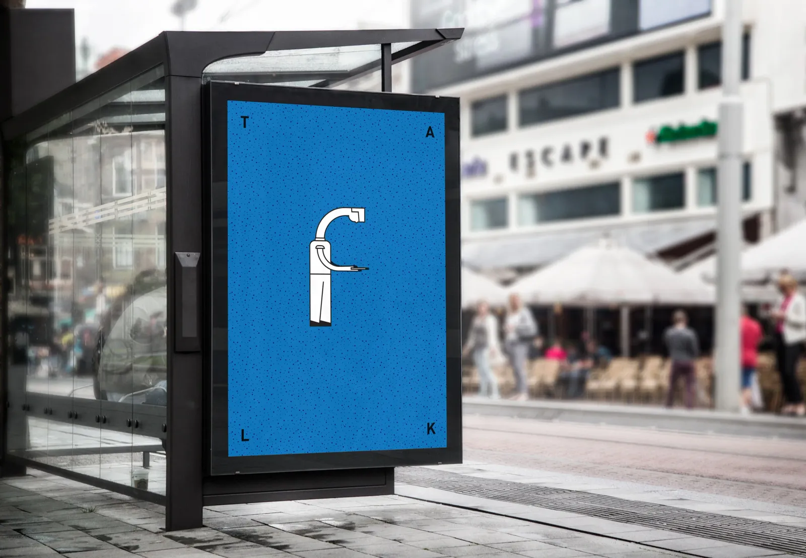 An editorial poster on a street-furniture panel: a lowercase f on a blue ground, photographed on a shopping street.